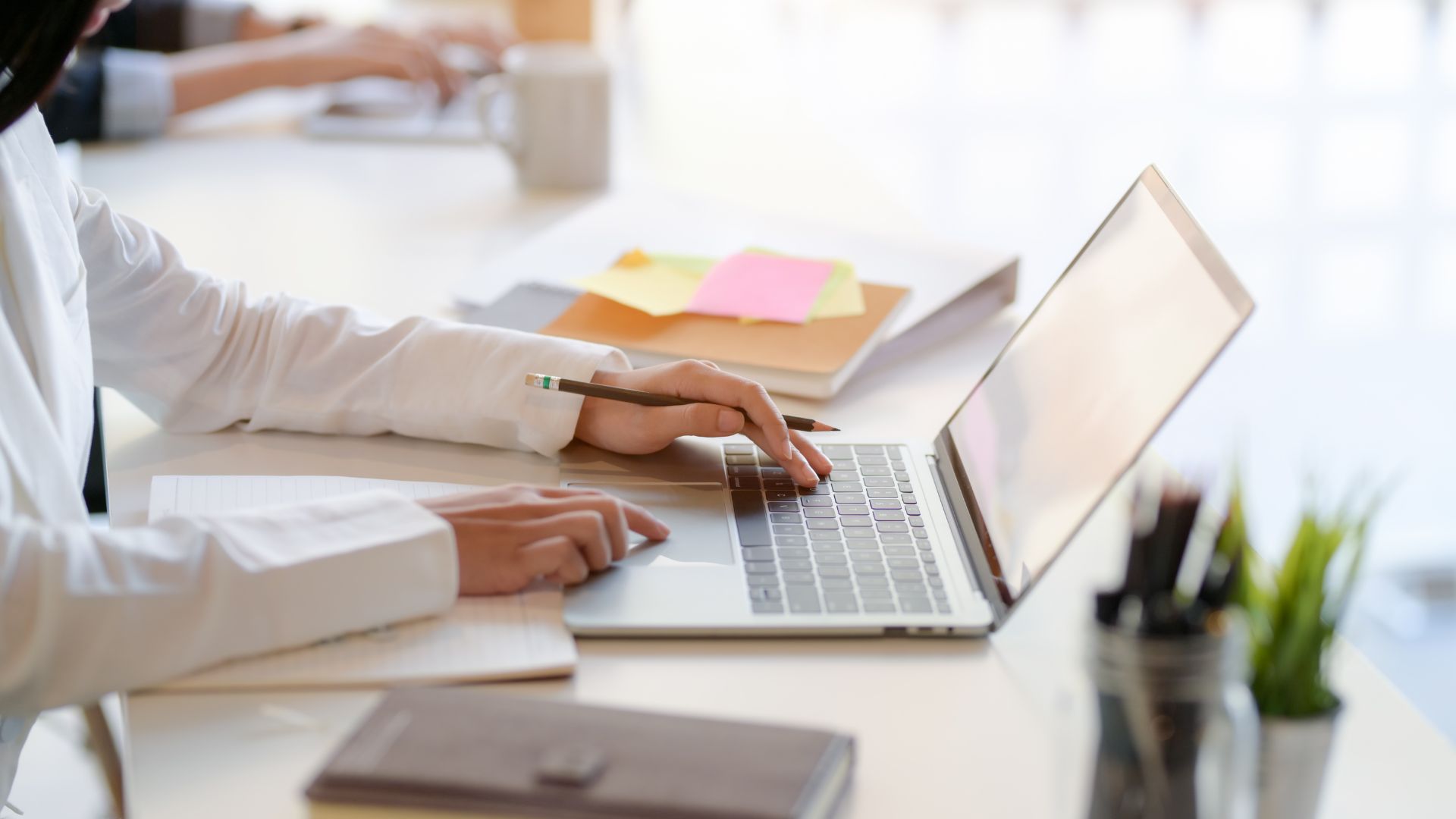close up of a person using a laptop
