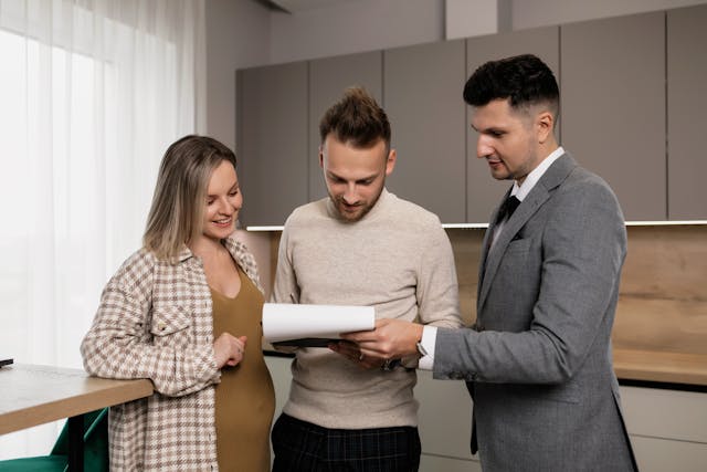 landlord speaking with two tenants (2)