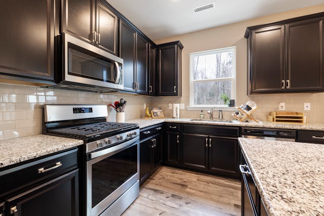 kitchen with black cupboards (3)