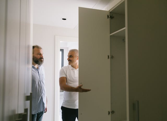 two people inspecting a closet