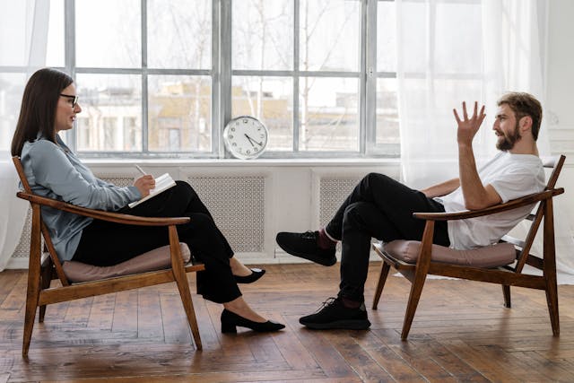 two people sitting accross from eachother