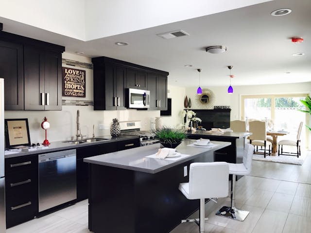 kitchen with black cupboards and island