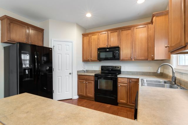 kitchen with brown cupboards (2)