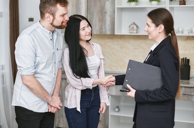 person shaking hands with tenants