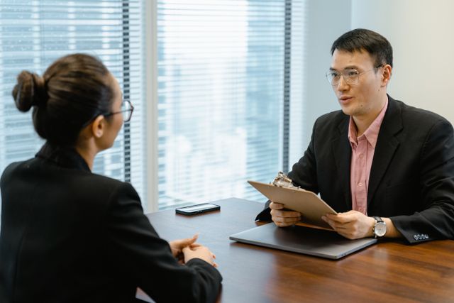 two people sitting at a desk (2)