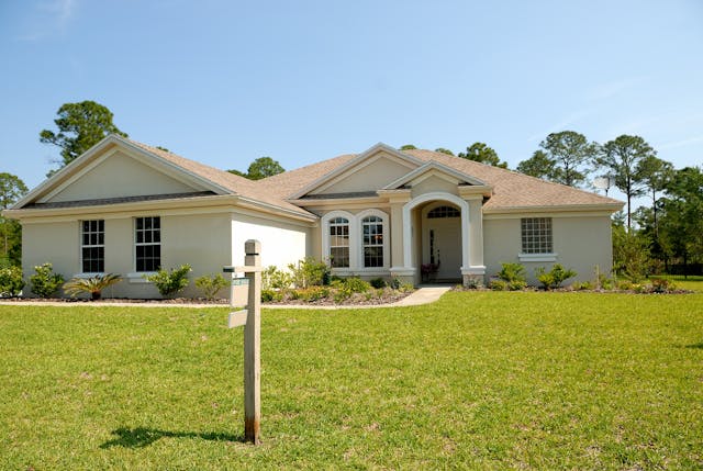 house with a for sale sign in front (2)