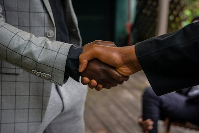 Two property managers shaking hands