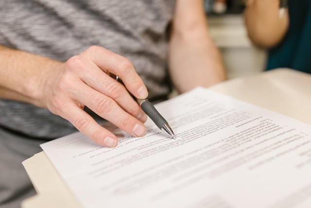 person reading through a lease agreement (5)