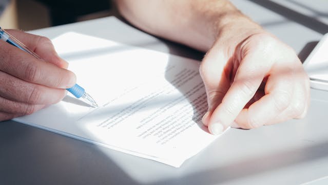 person reading through a document (6)