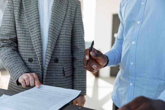 two people reading over a lease agreement
